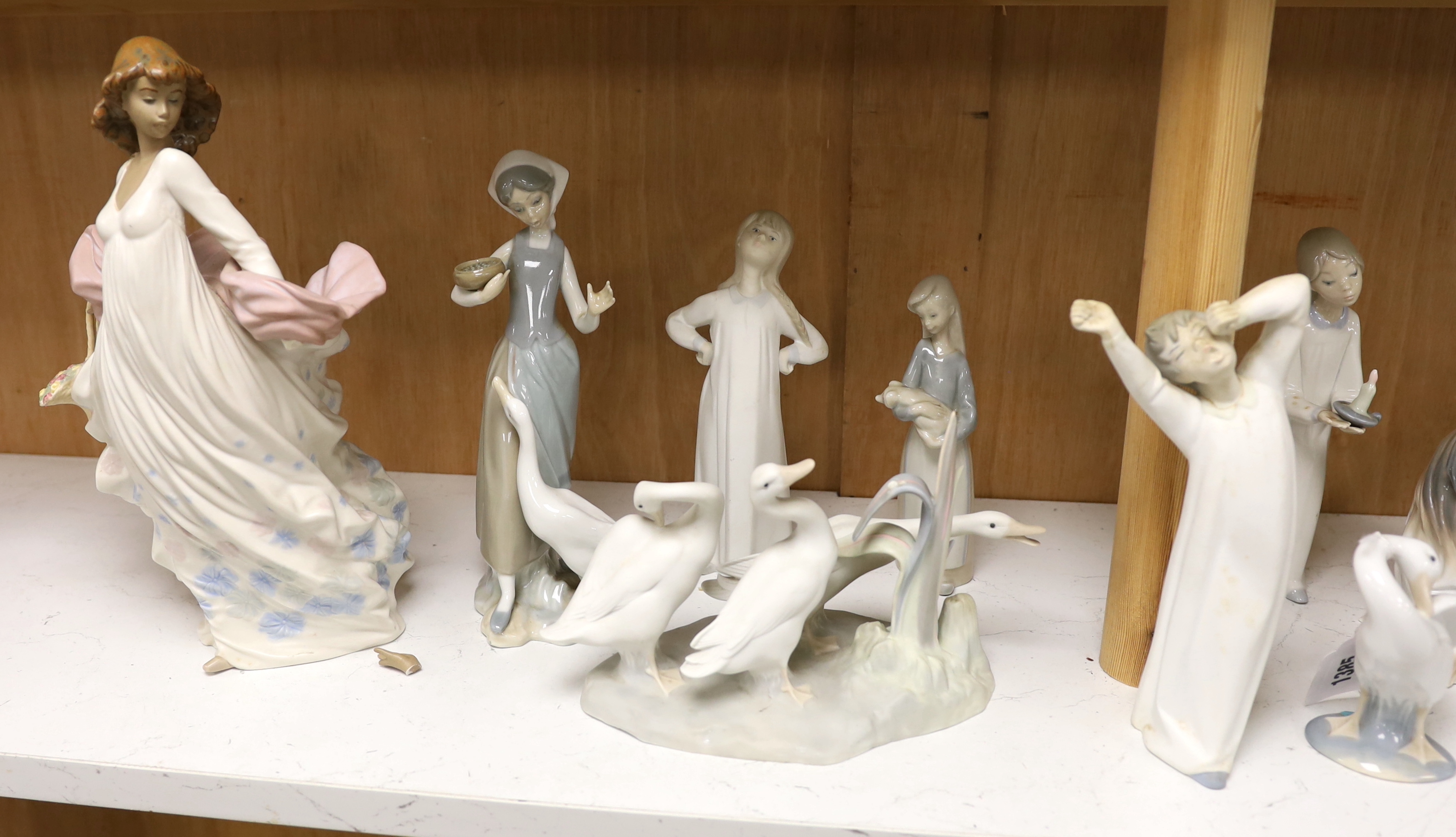 Twenty pieces of Lladro and Nao porcelain, tallest 31cm